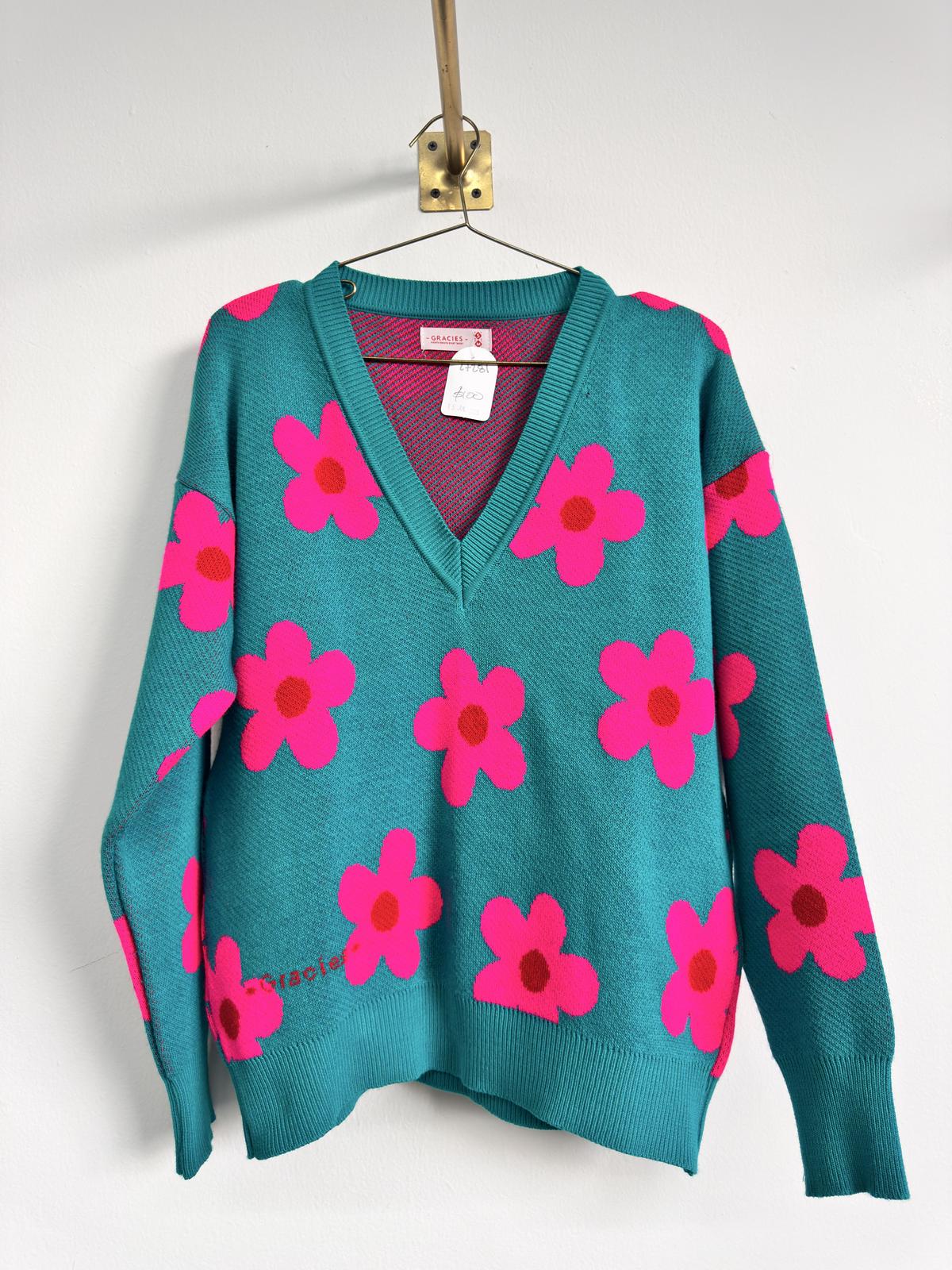 Suéter tejido con flores fucsia