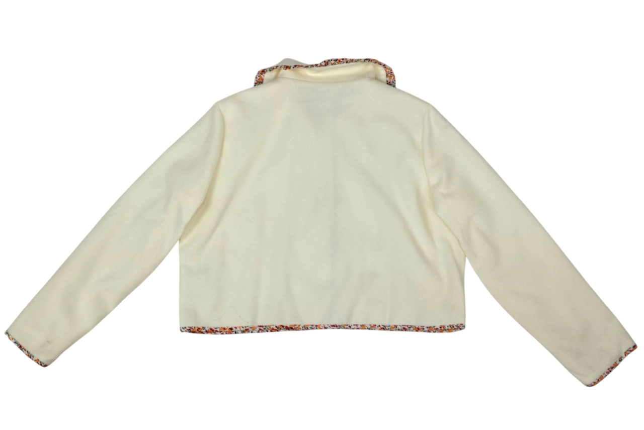 Chaqueta corta beige con detalles florales